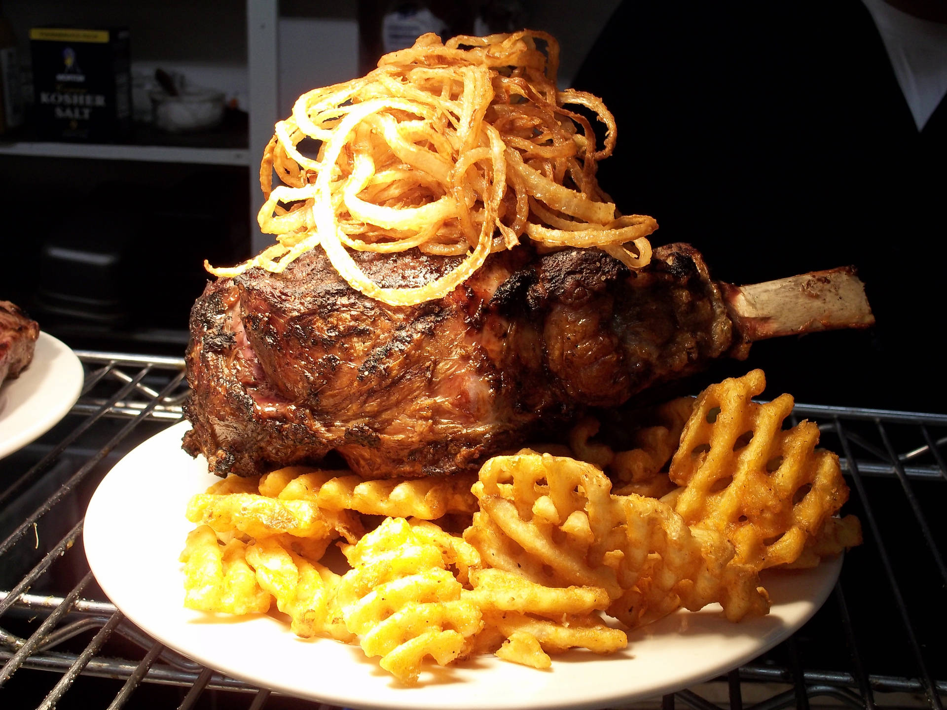 Rib Eye Meat With Onion Rings And Fries Background
