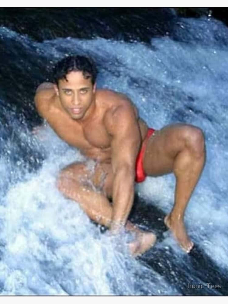 Ricardo Milos Posing In A River Background