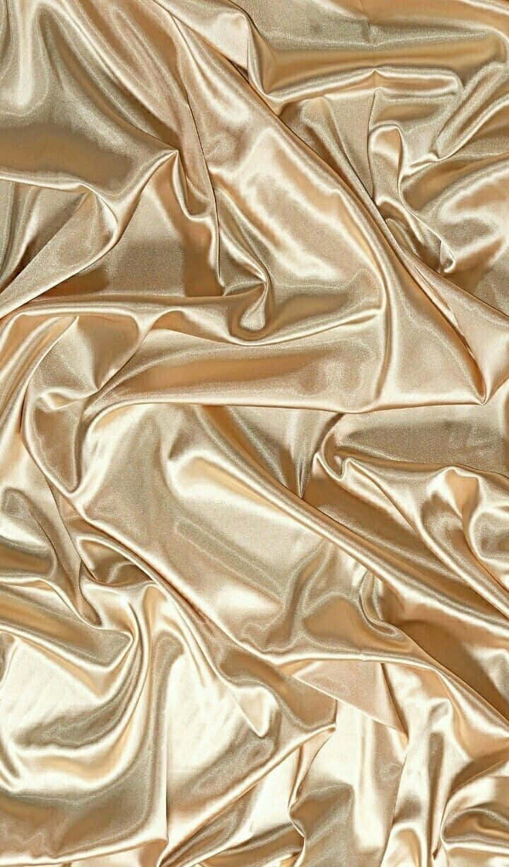 Rich Golden Silk Fabric Shining In The Light. Background