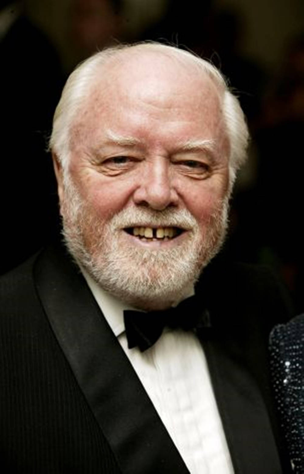 Richard Attenborough In Tuxedo Black Background Background