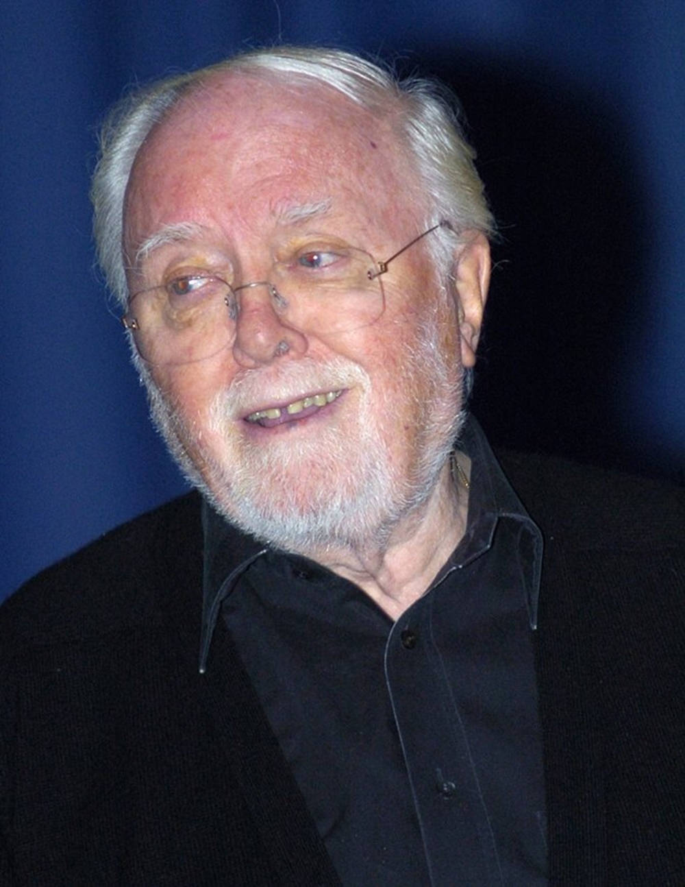 Richard Attenborough On Blue Background Background