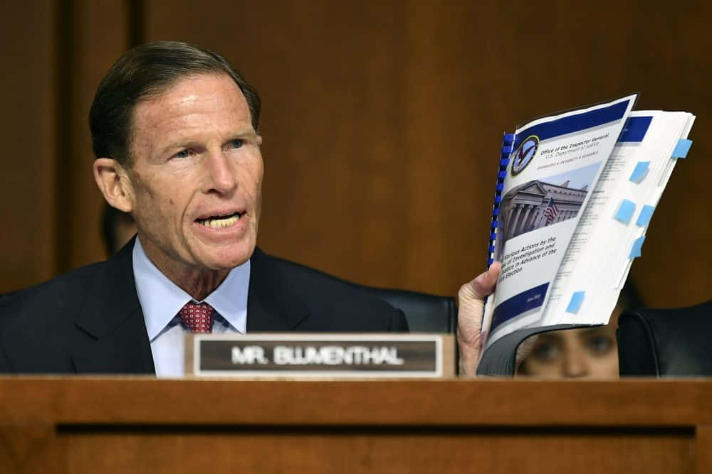 Richard Blumenthal Holding A Book