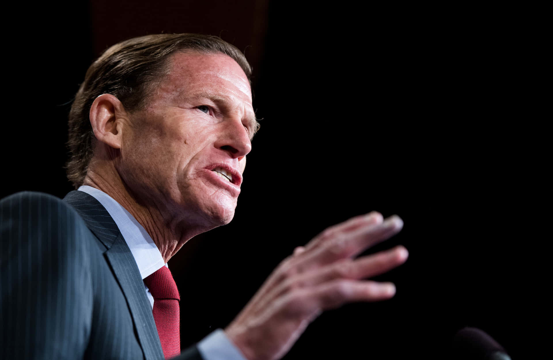 Richard Blumenthal Posing Against Black Backdrop