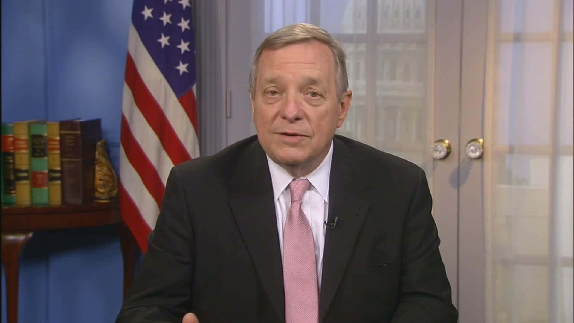 Richard Durbin With Flag In Background Background