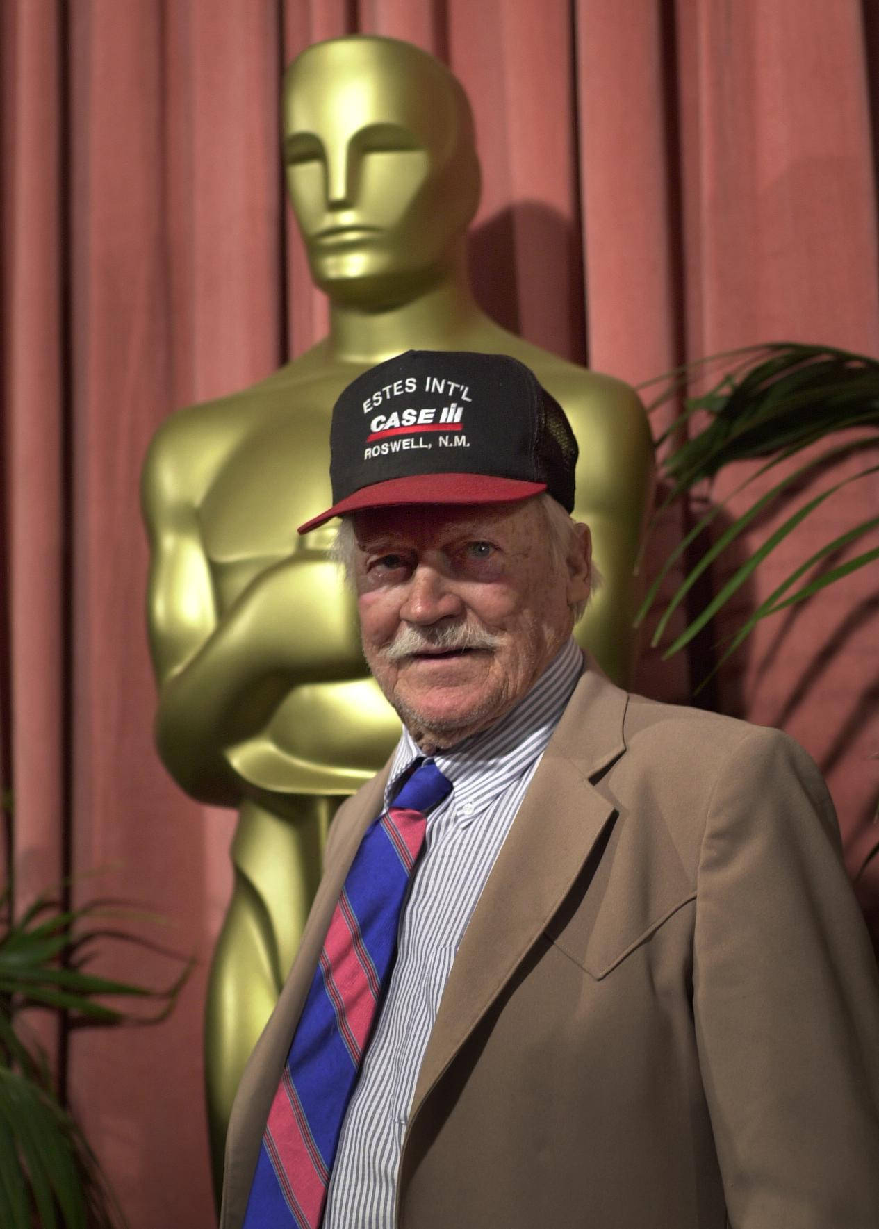 Richard Farnsworth Holding His Golden Trophy Statue