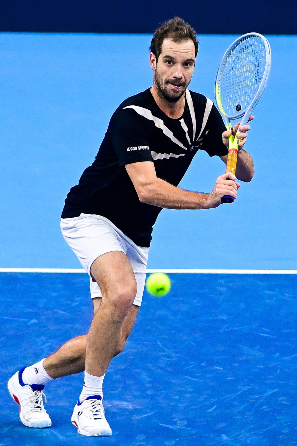 Richard Gasquet Running To Reach Ball Background