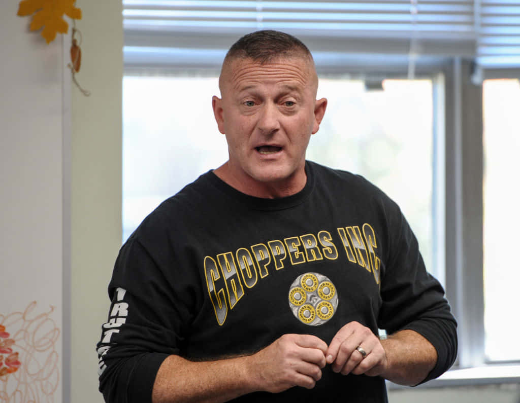 Richard Ojeda Delivering A Passionate Speech To An Engaged Audience. Background