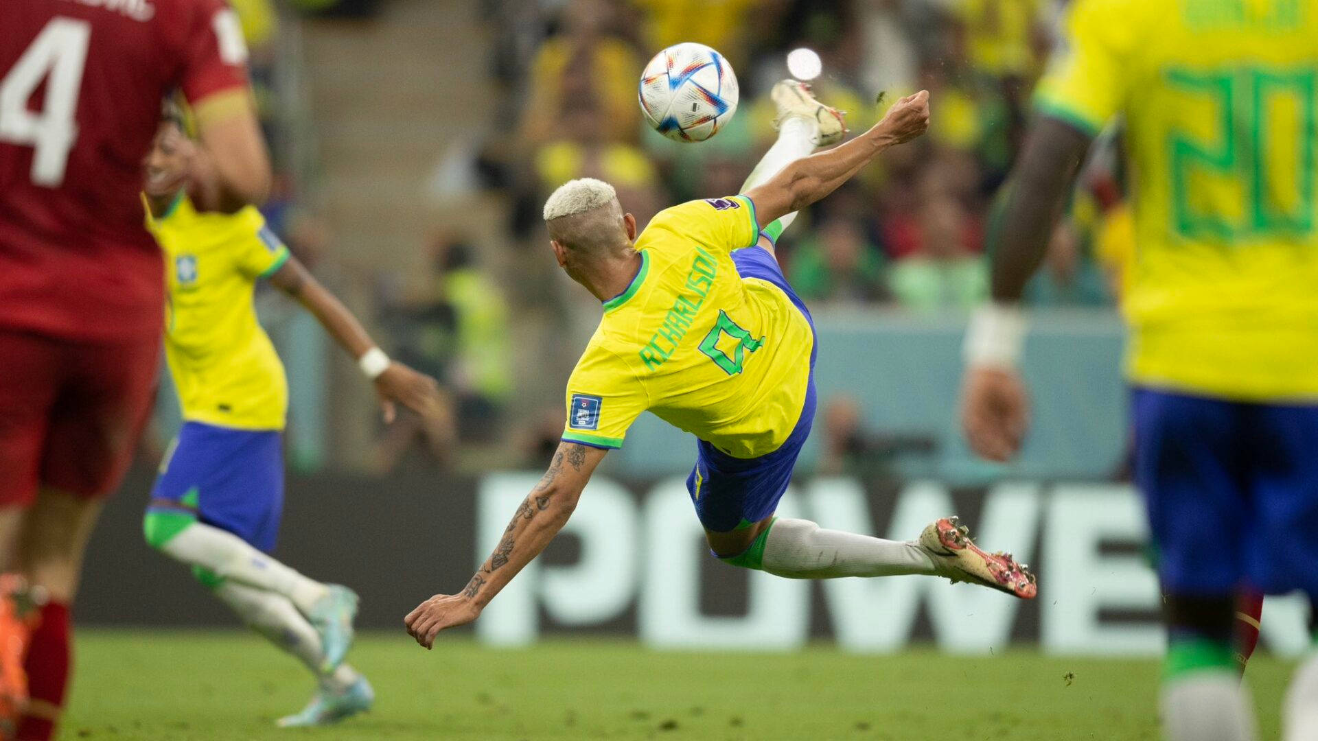 Richarlison De Andrade Kicking Football Background