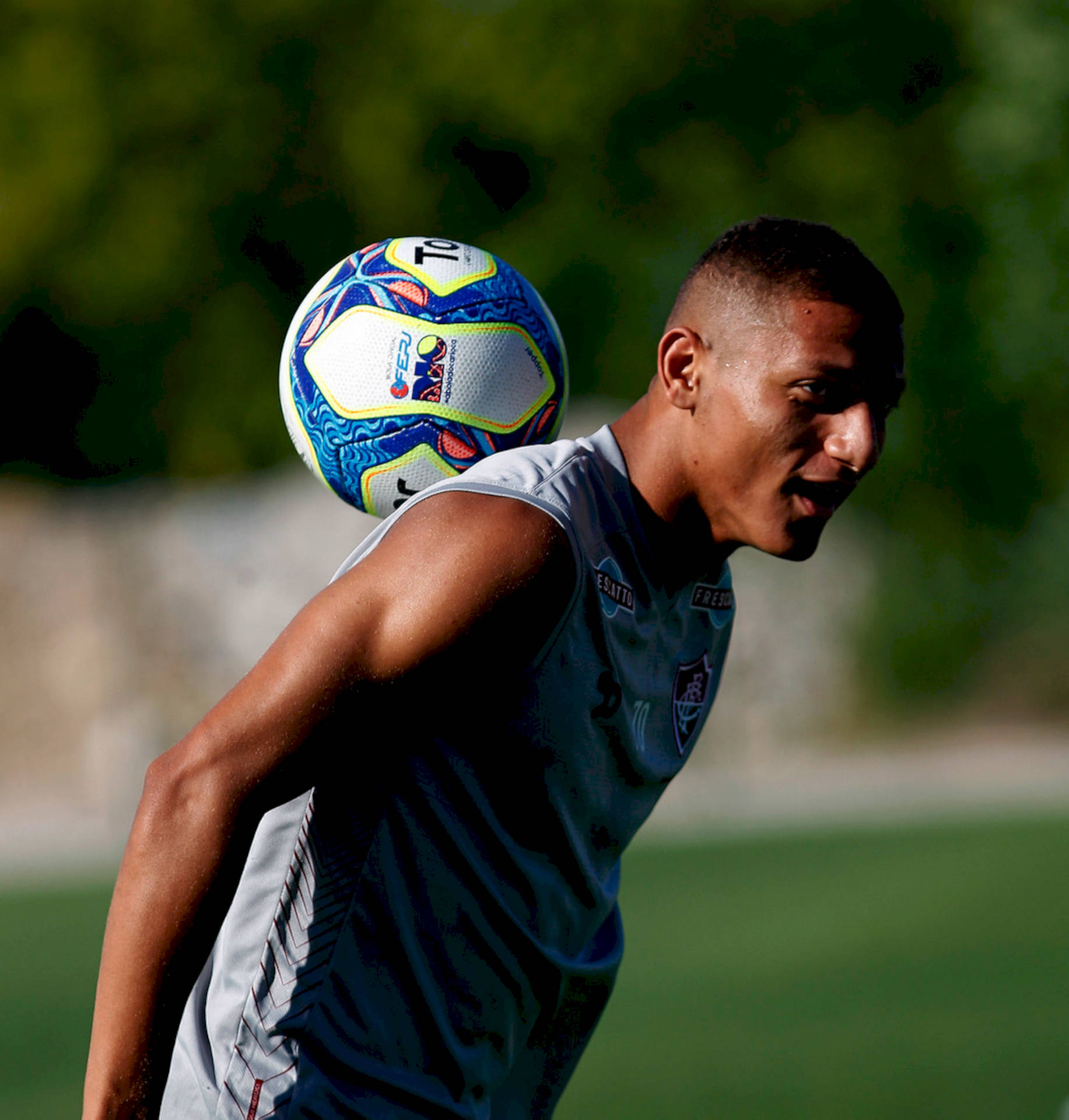 Richarlison De Andrade With A Ball On Back Background