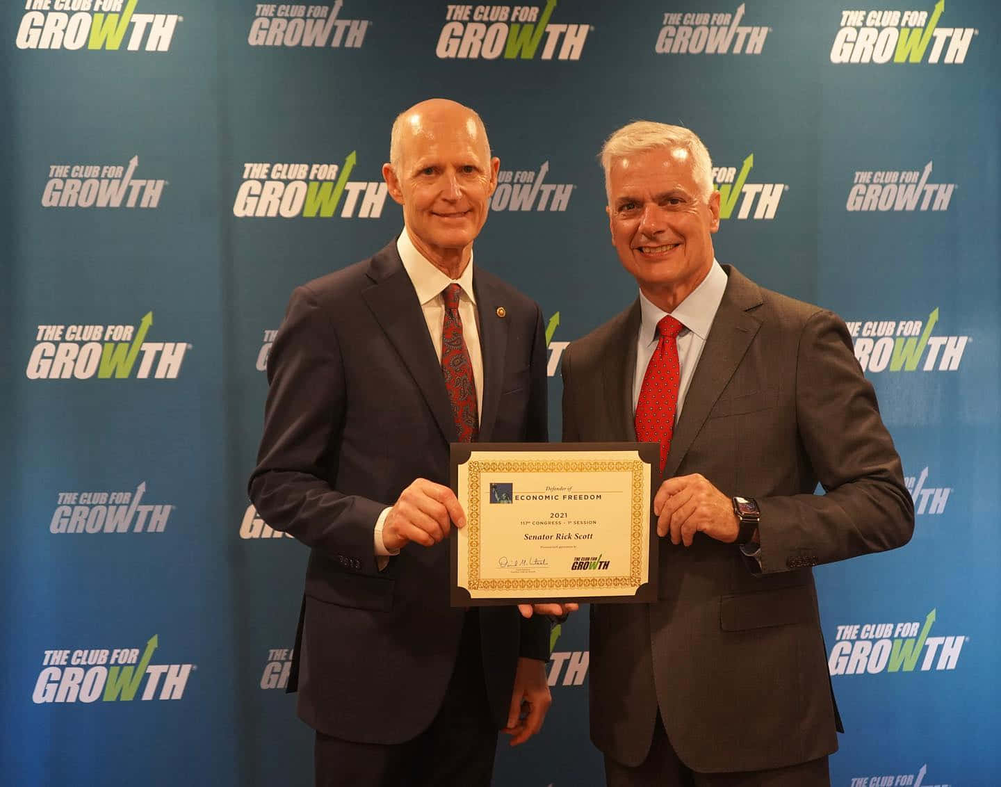 Rick Scott Receives A Certificate Background