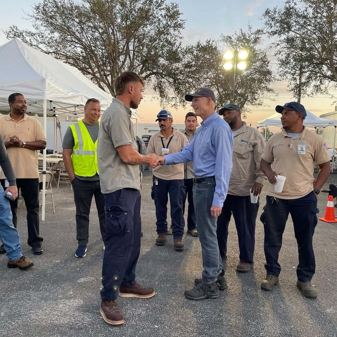 Rick Scott Shakes Hands With Worker