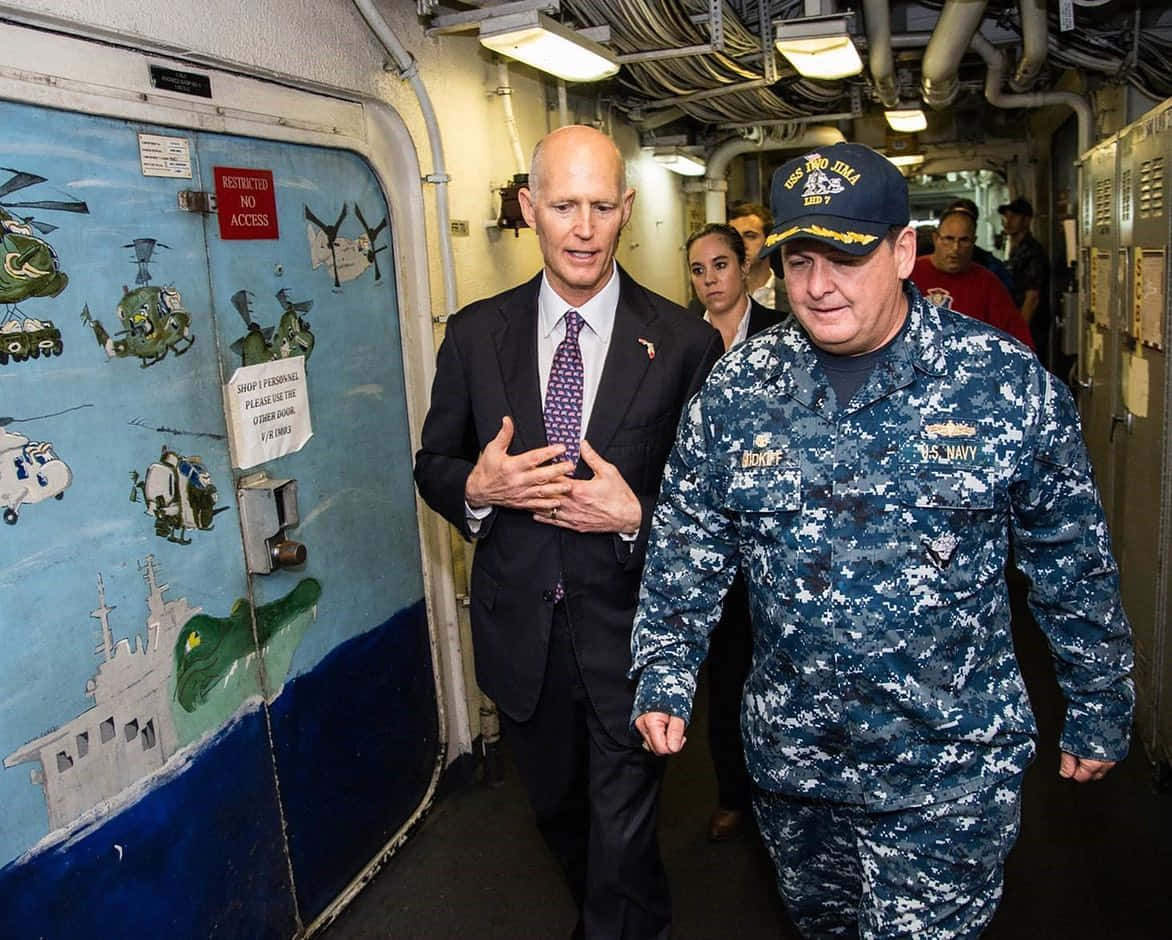 Rick Scott With Us Navy Soldier Background