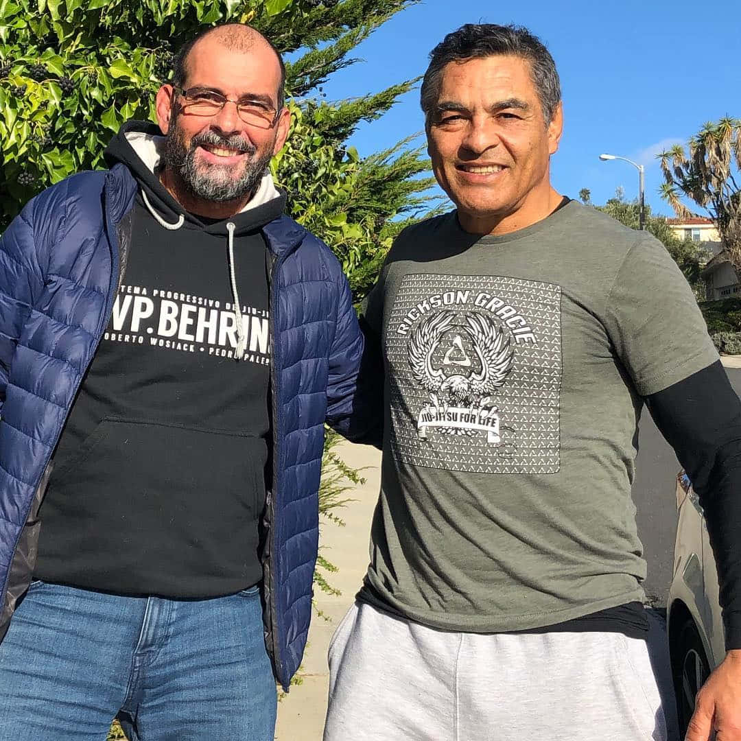 Rickson Gracieand Friend Outdoors Background