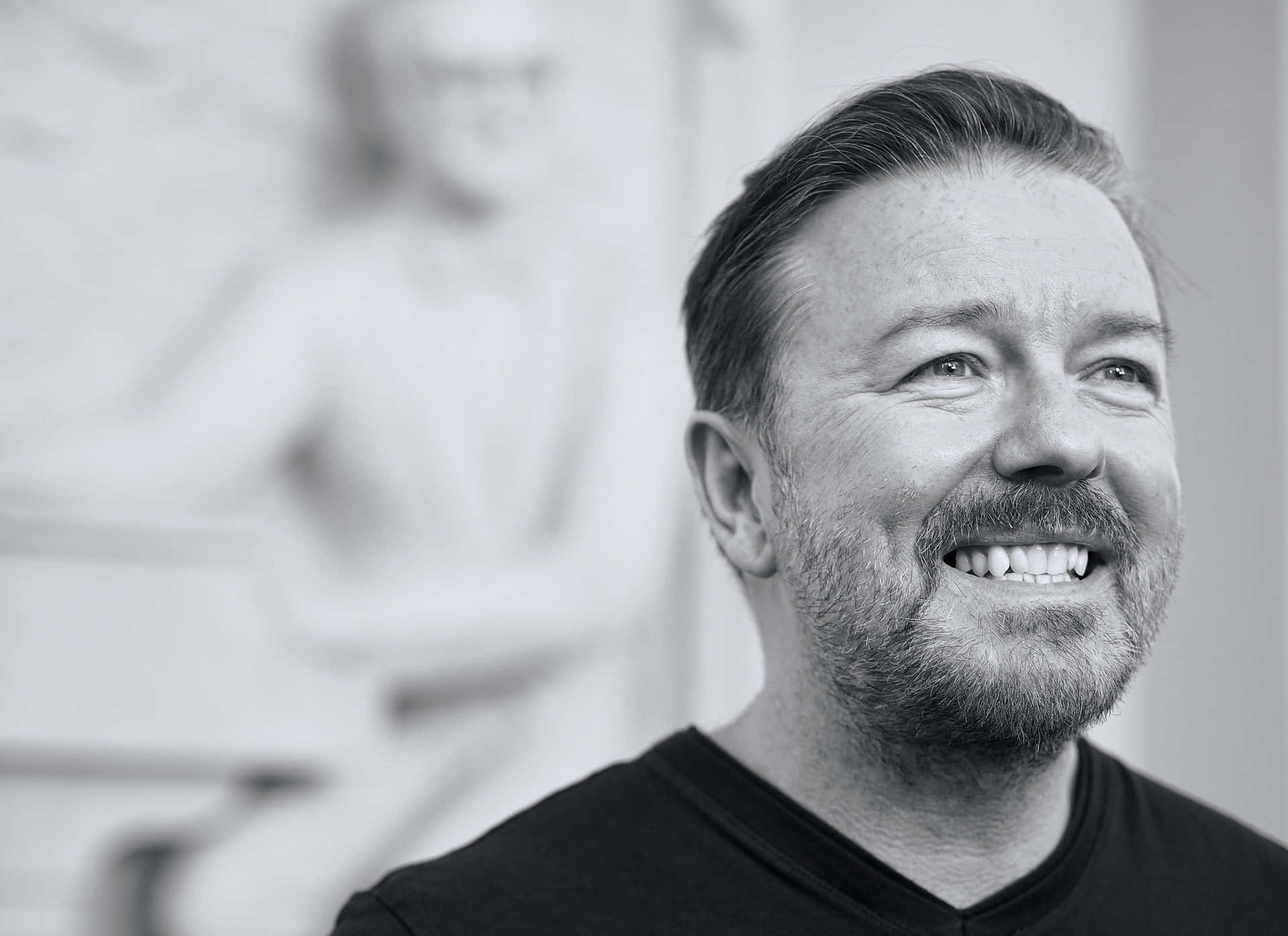 Ricky Gervais, Bringing Laughter And Joy To Millions Background