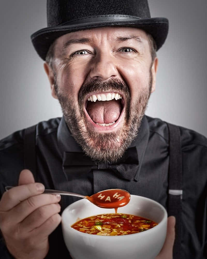 Ricky Gervais Looking Calm And Collected Background