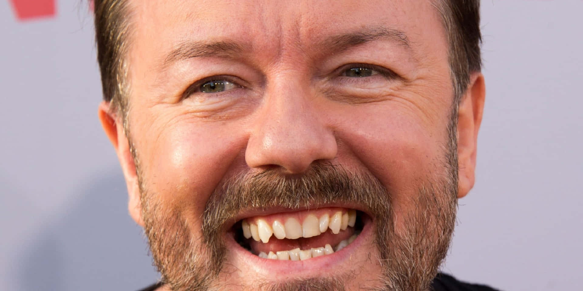 Ricky Gervais Puts On A Smile