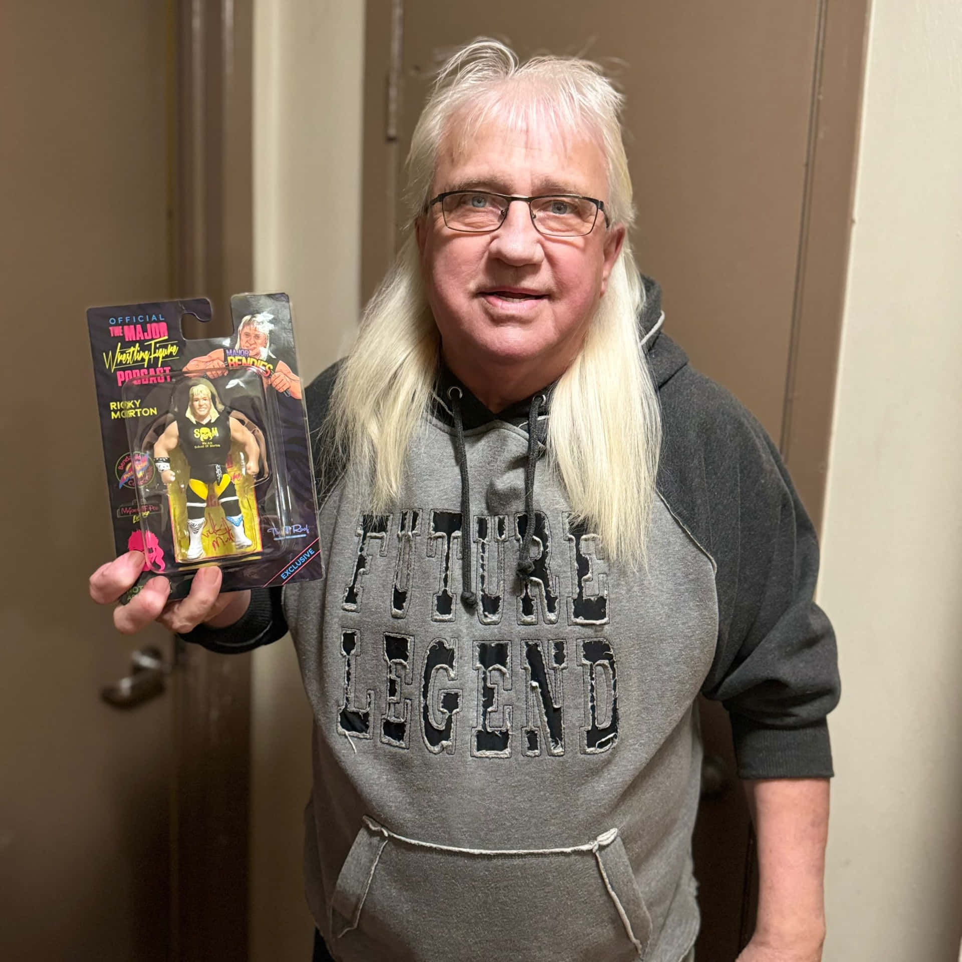 Ricky Morton Holding Action Figure Background
