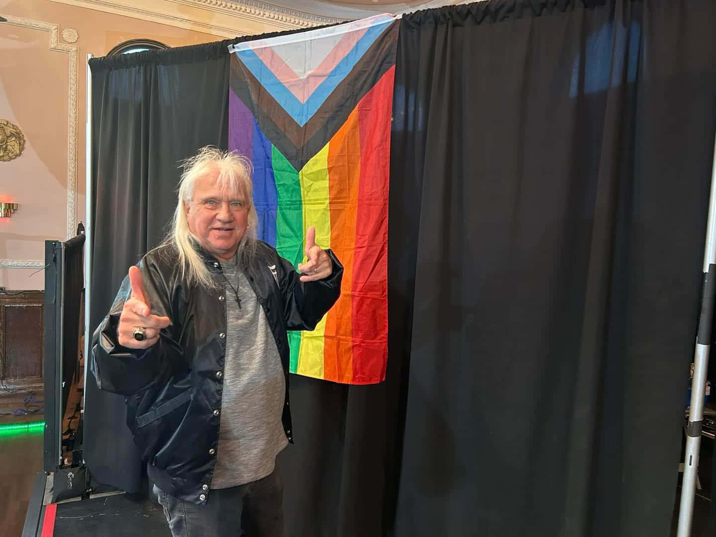 Ricky Morton Posing With Lgbtq Pride Flag Background