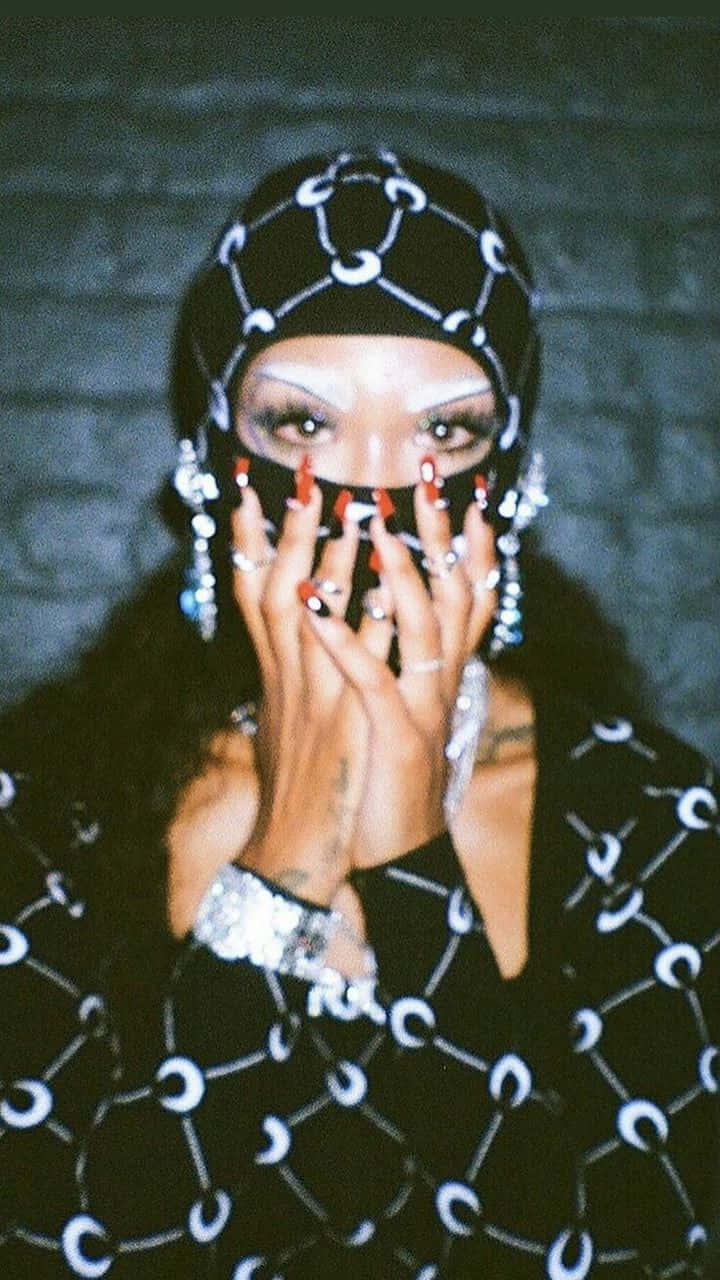 Rico Nasty In Her Signature Style, Embracing Her Individuality. Background
