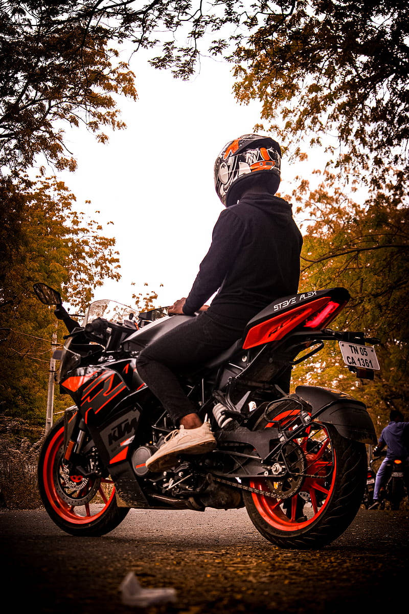 Rider On Red Ktm Rc 200 Background