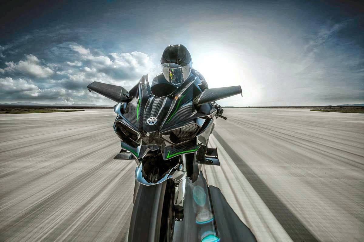 Rider Runs Kawasaki H2r Under Bright Background