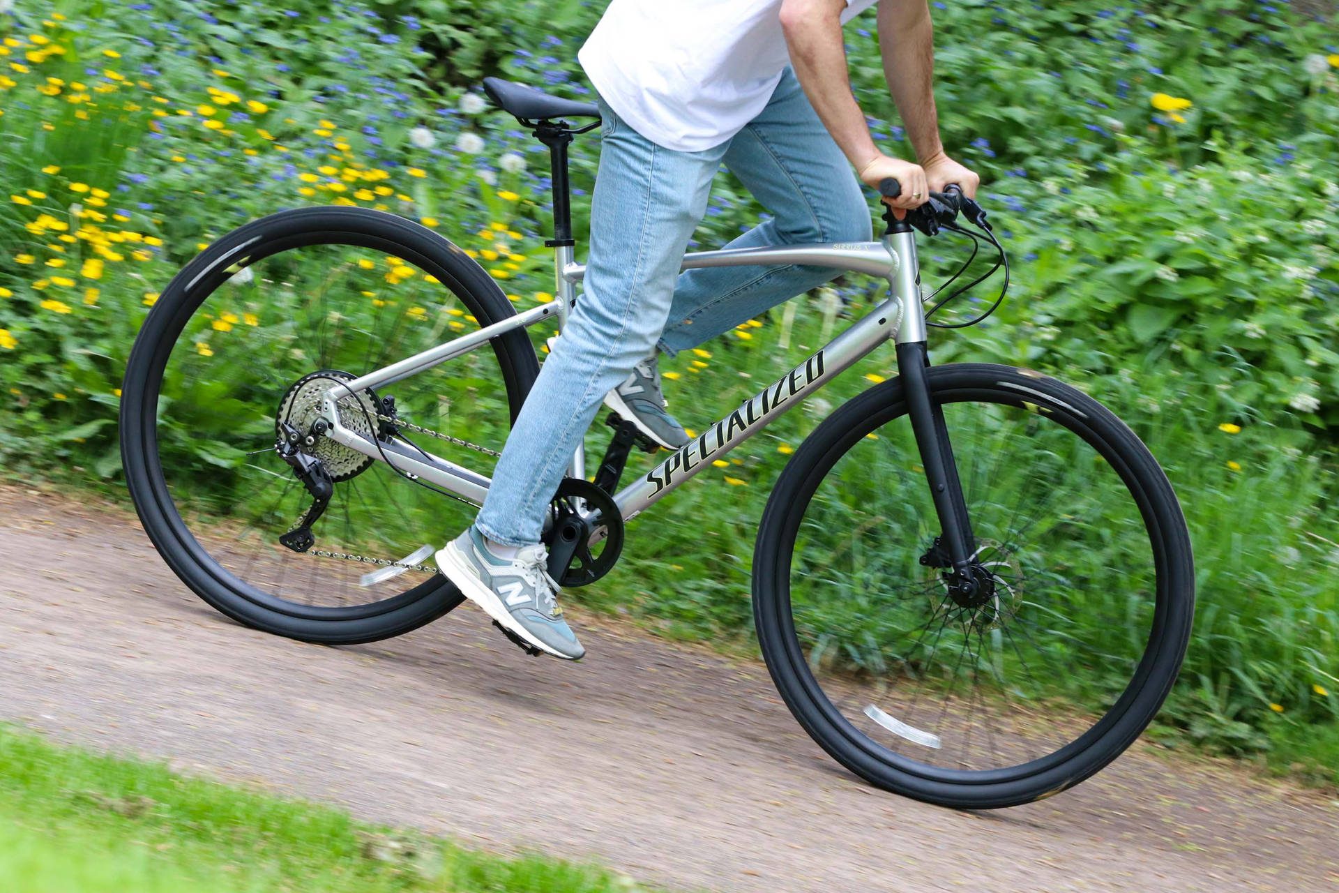 Riding Specialized Bike In Jeans Background