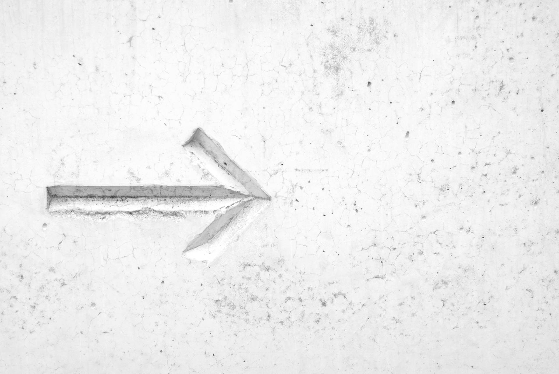 Right Arrow Sign On White Wall Background