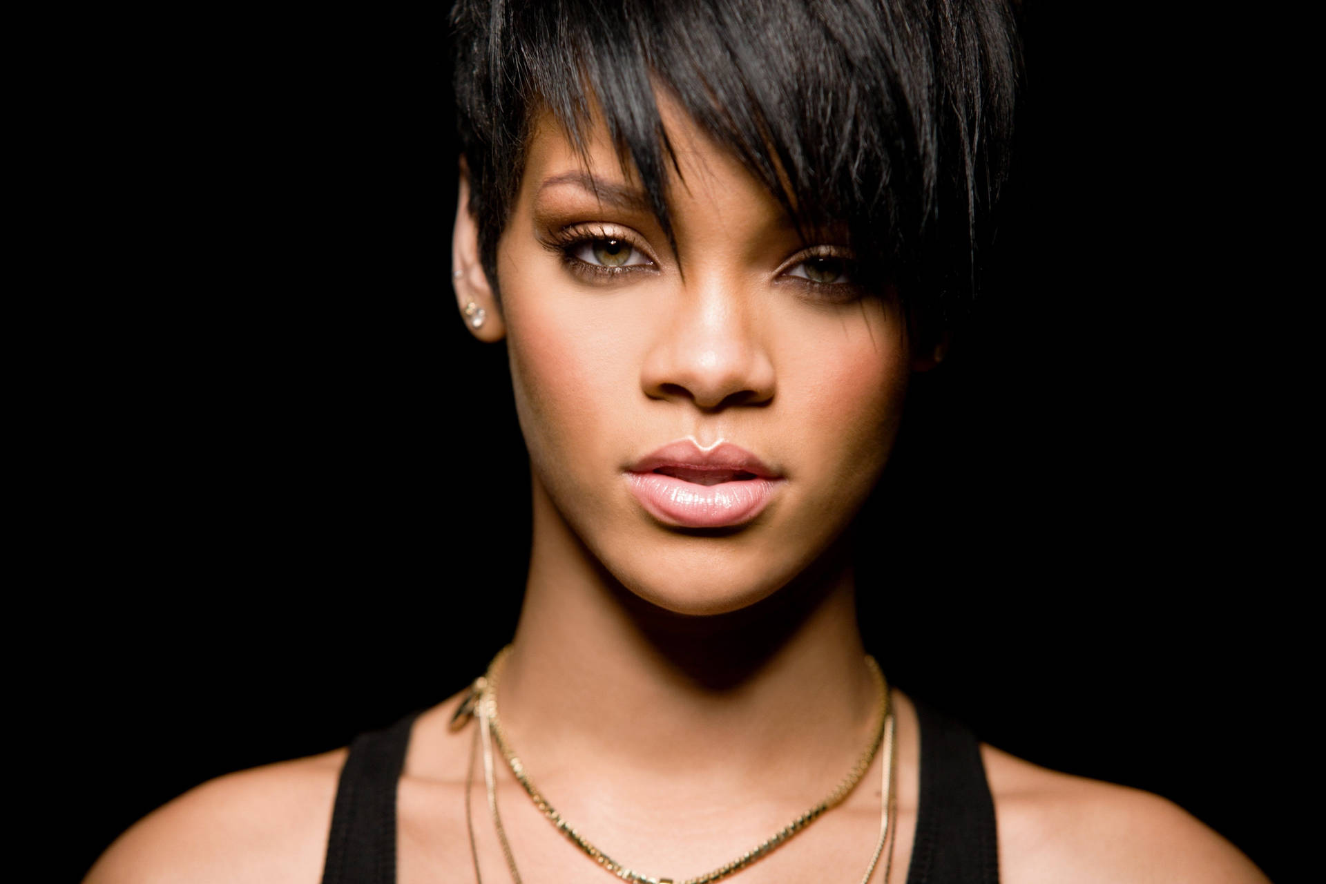 Rihanna In Sporty Look With Short Hair Background