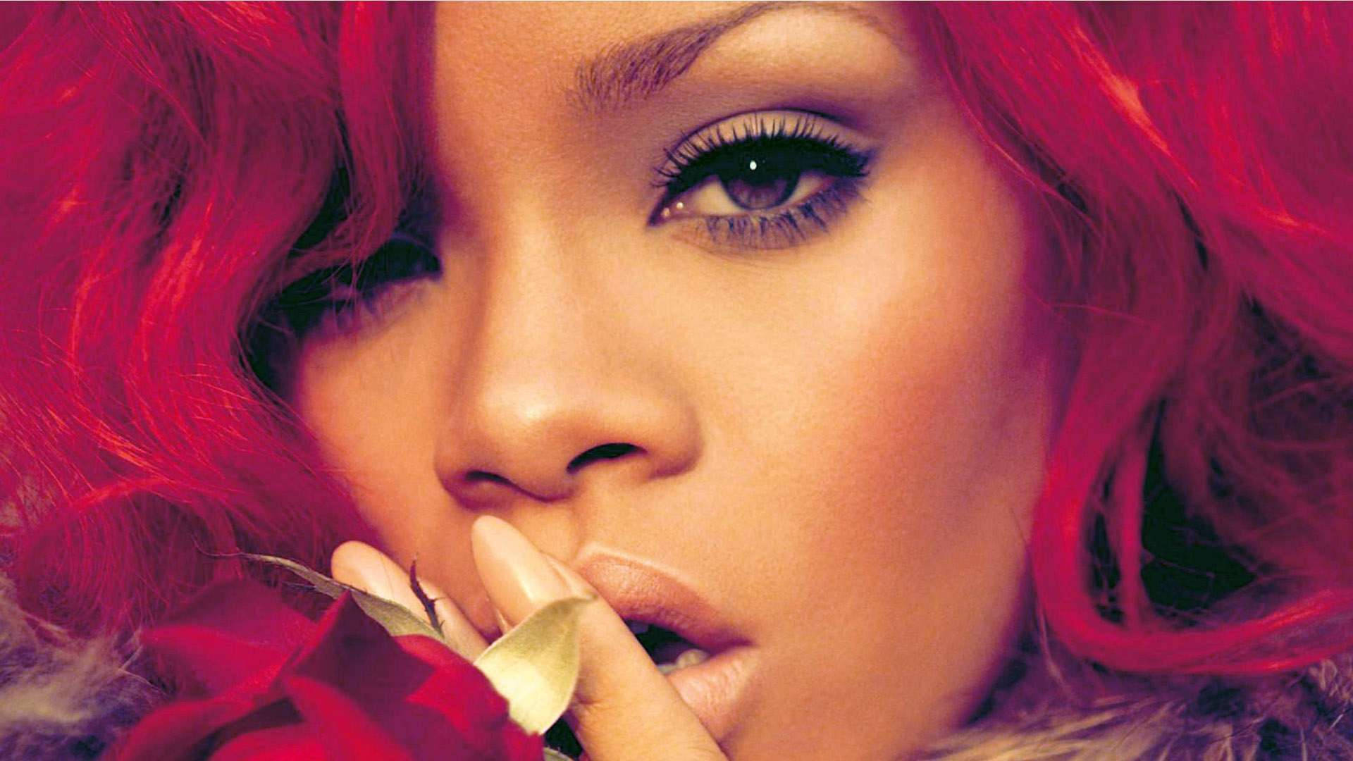 “rihanna Oozing Confidence In Her Signature Red Locks” Background