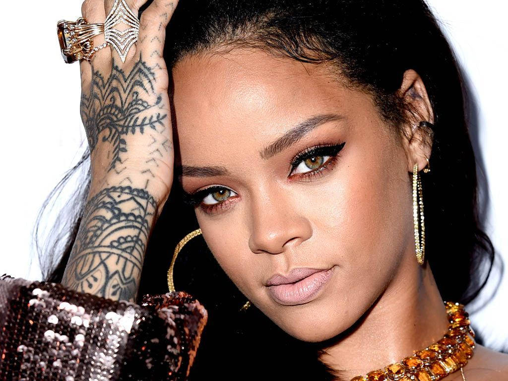 Rihanna Shines With Her Unique Tattoo Background