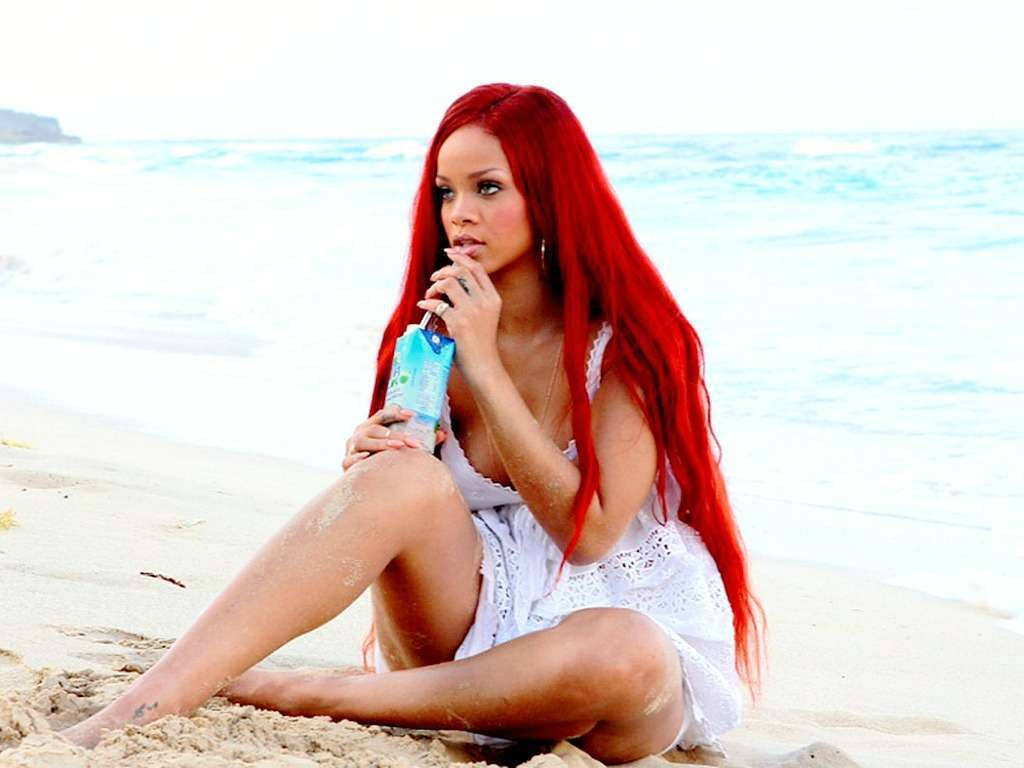 Rihanna Takes A Stroll Along The Beach Background