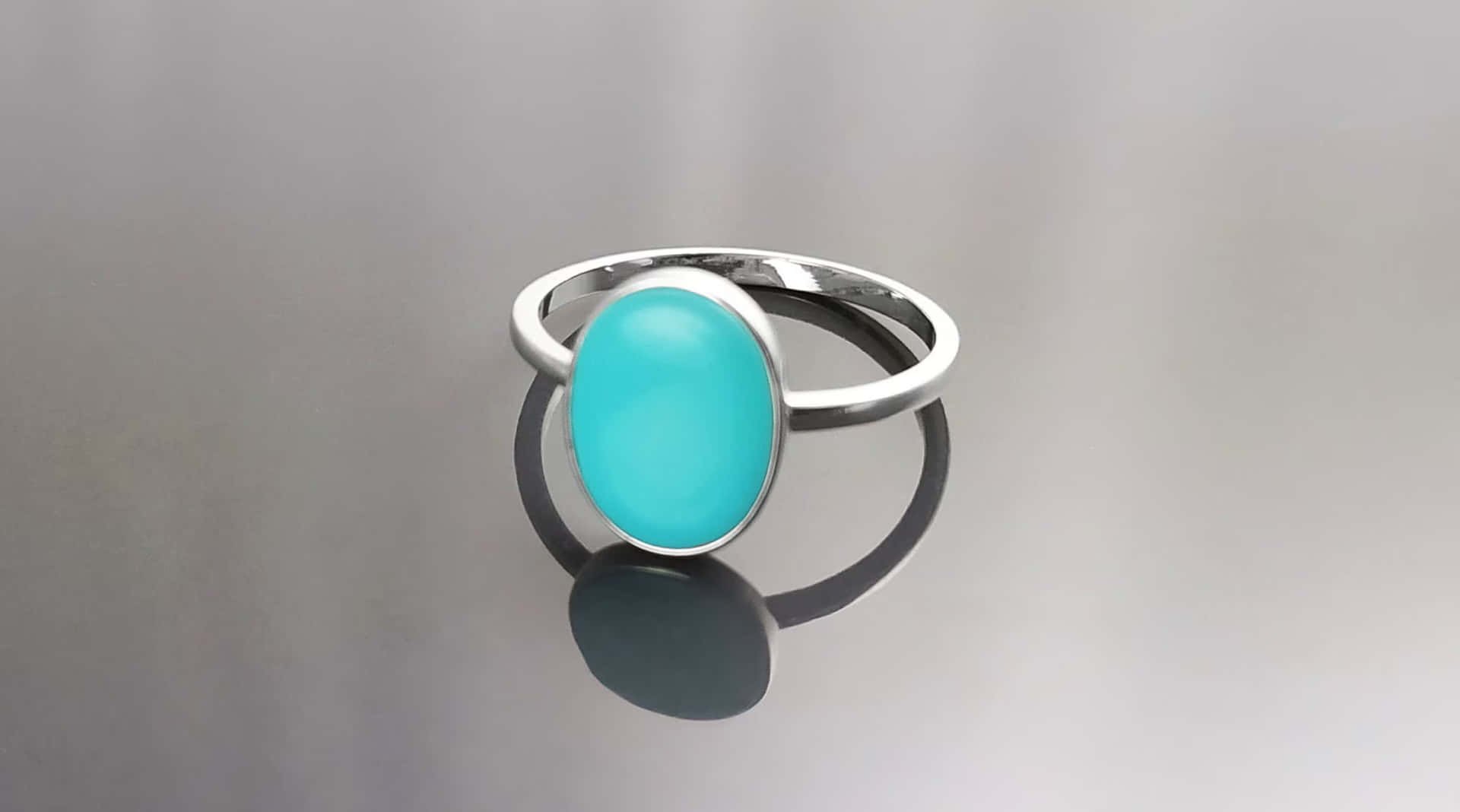 Ring With Bright Blue Oval Stone Background