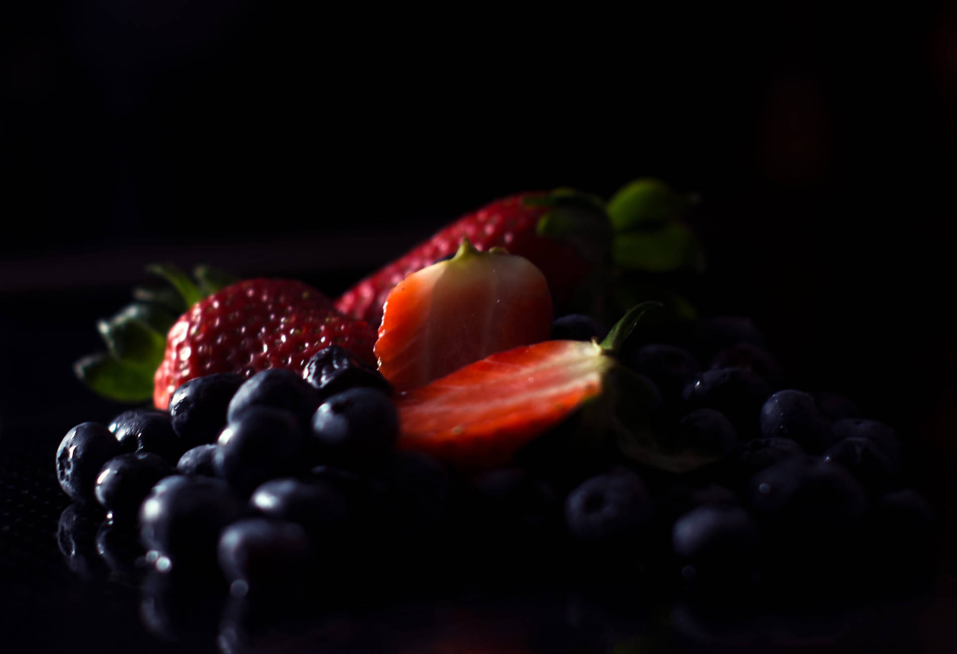 Ripe Huckleberry And Strawberries Background