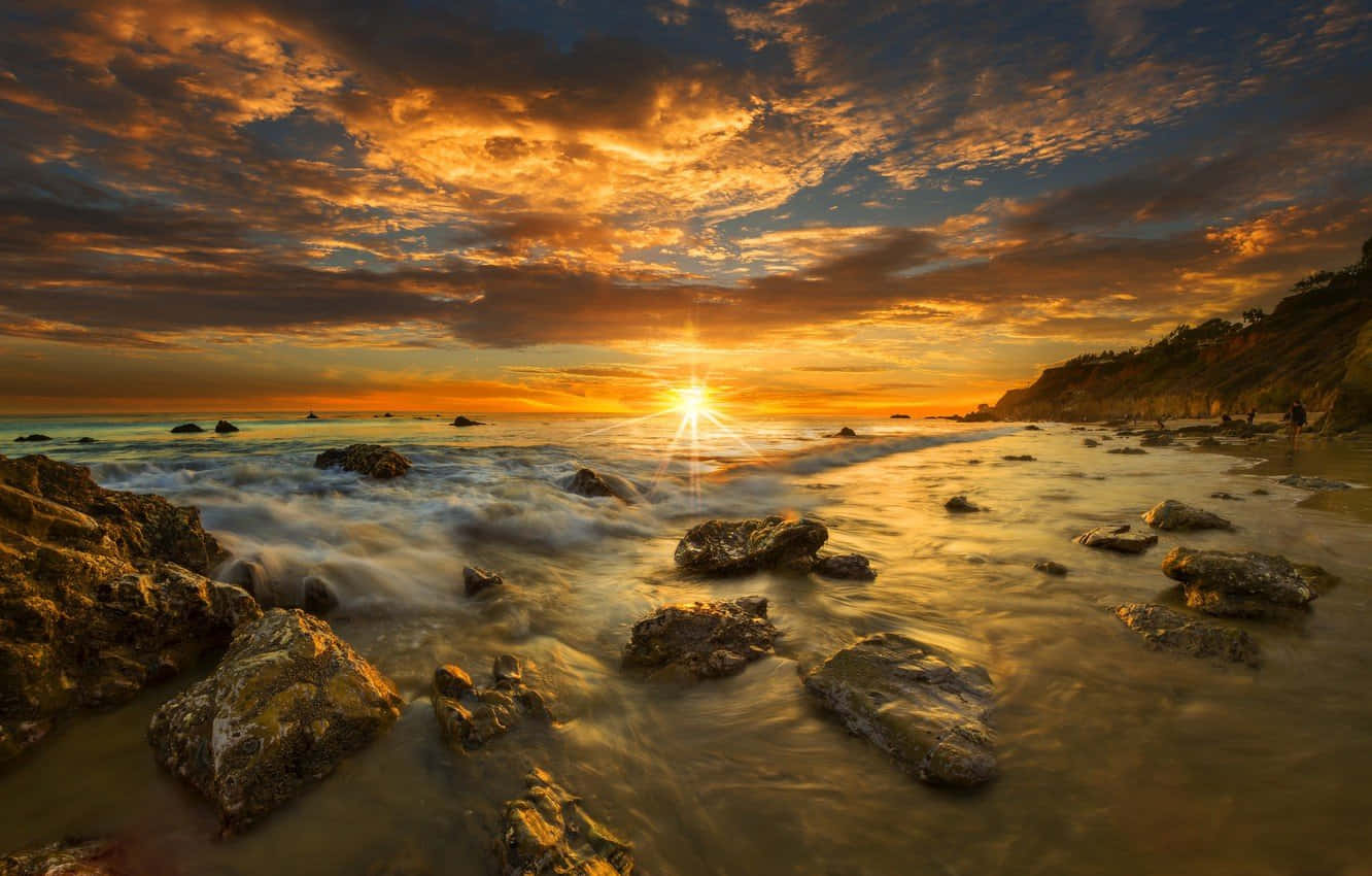 Rise And Shine At Malibu Beach Background