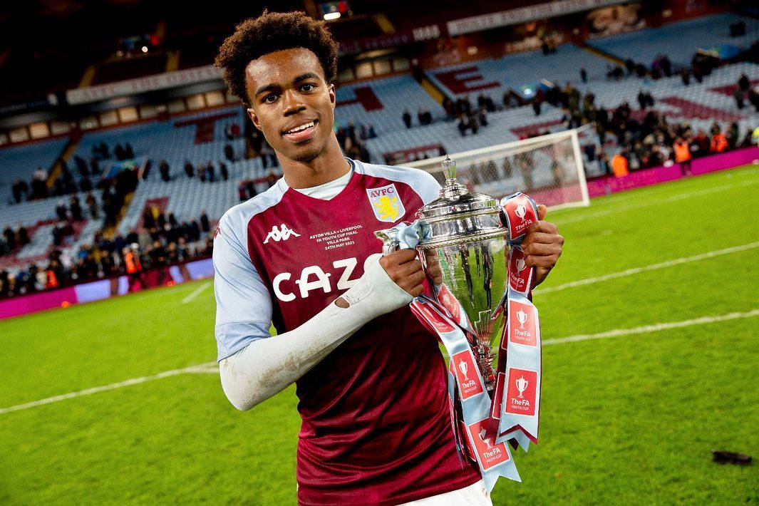 Rising Soccer Star, Carney Chukwuemeka Holding A Trophy Triumphantly Background