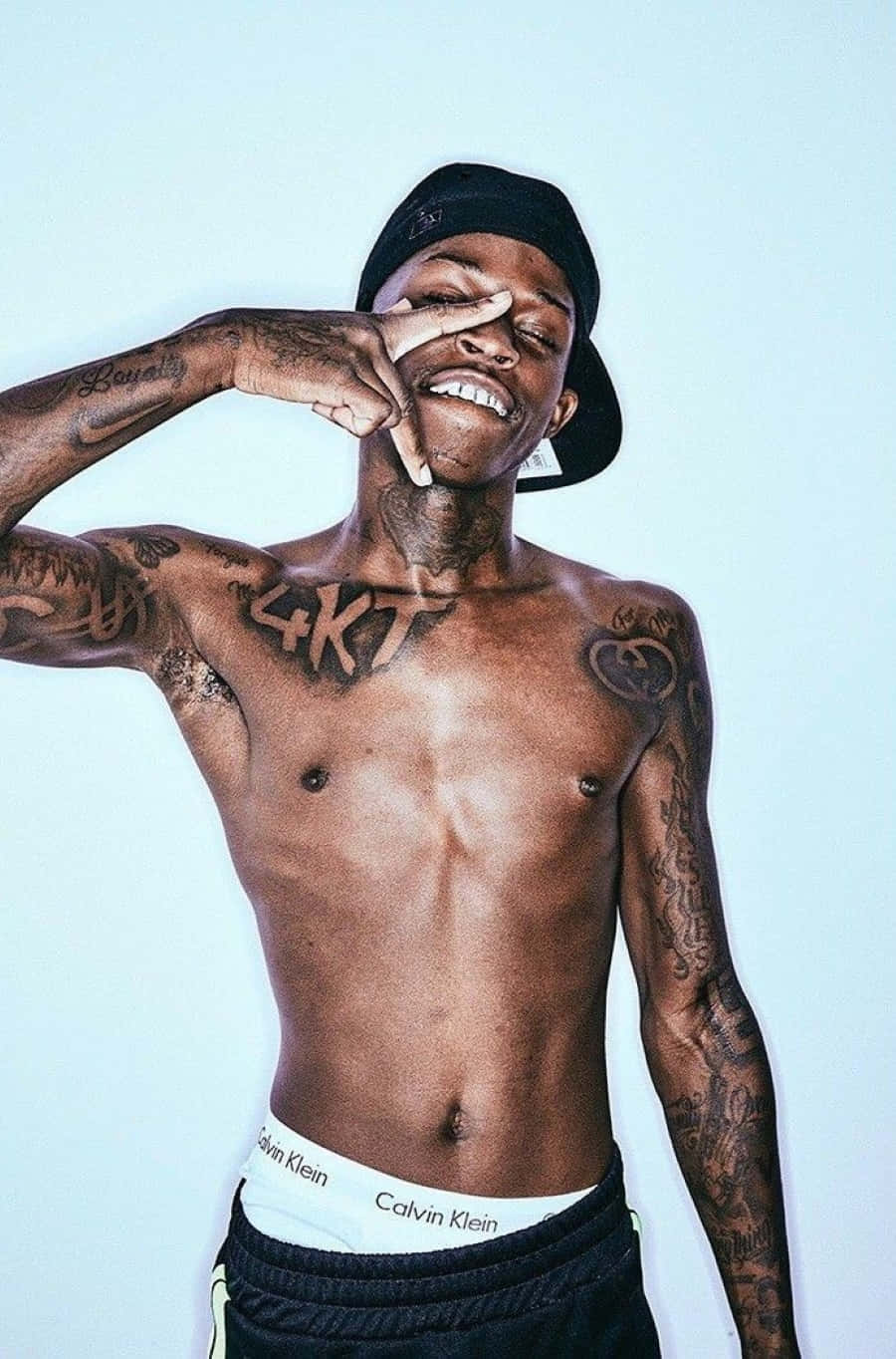 Rising Star Quando Rondo Poses For A Photoshoot Background