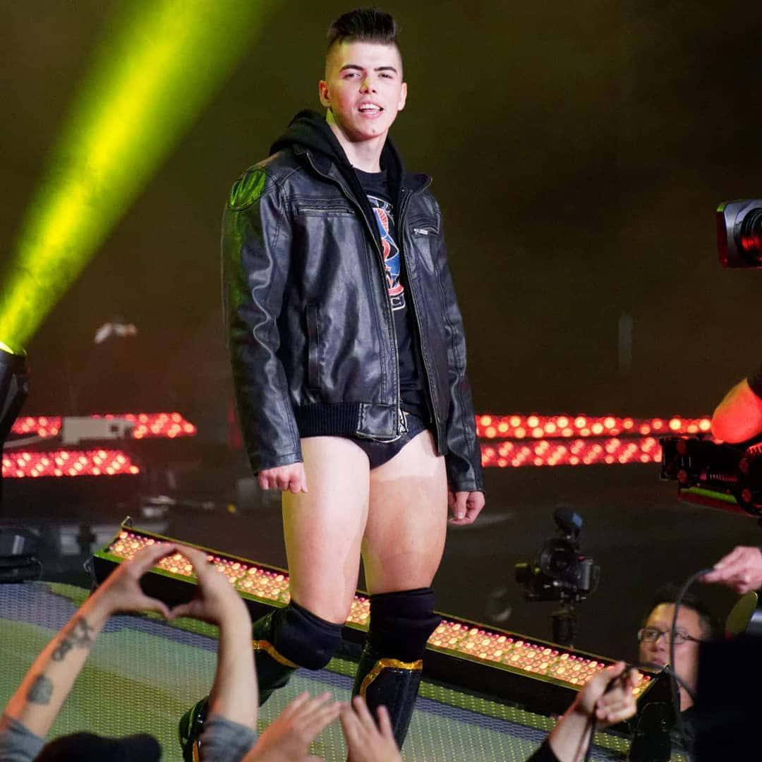 Rising Star Sammy Guevara Dressed In A Leather Jacket Background