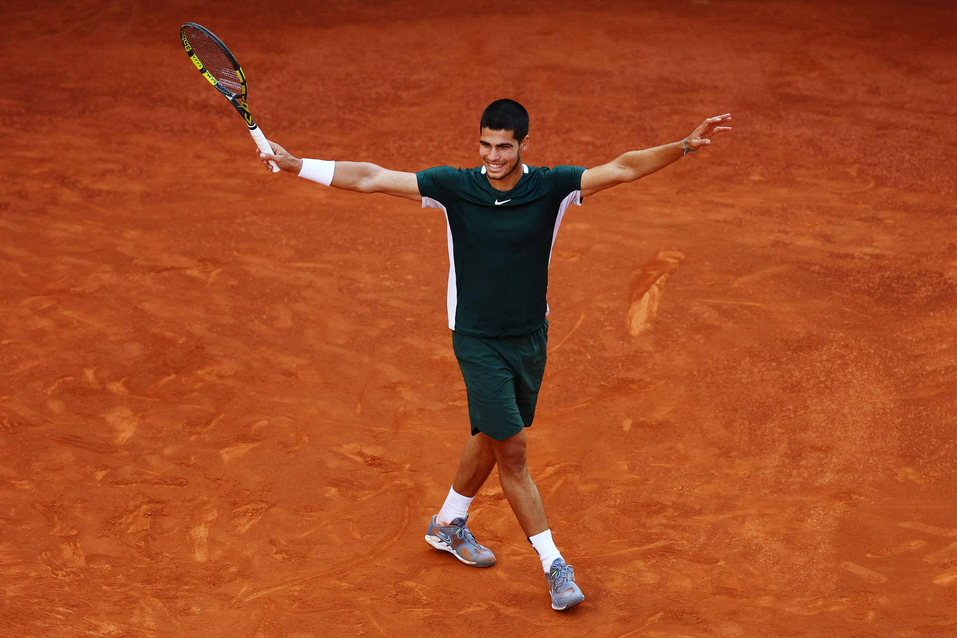 Rising Tennis Star Carlos Alcaraz In Action At French Open Background