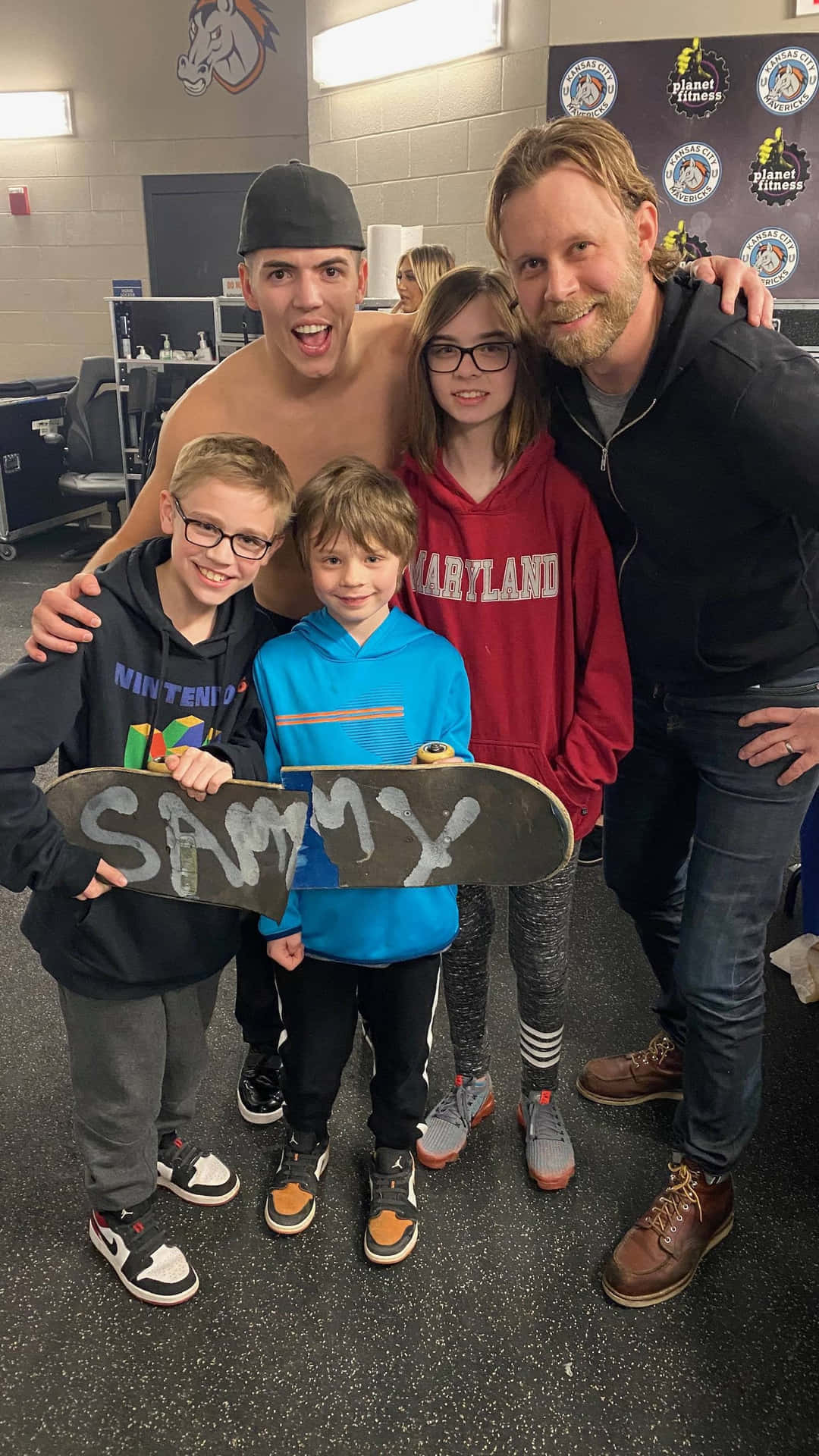 Rising Wrestling Star Sammy Guevara Posing For A Photo With Adoring Fans.