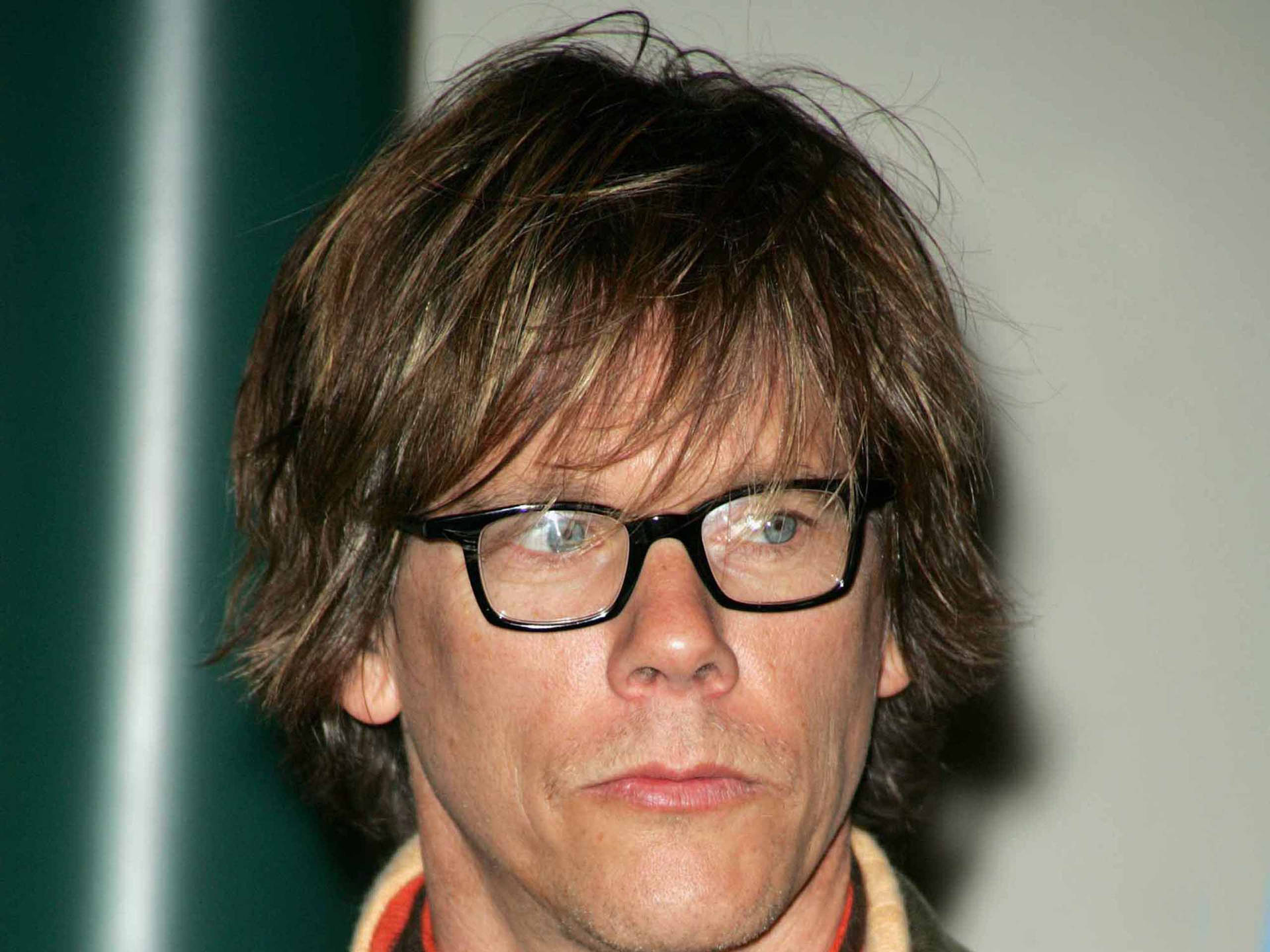 Riveting Hollywood Actor Kevin Bacon Sporting A Long Hairstyle Background