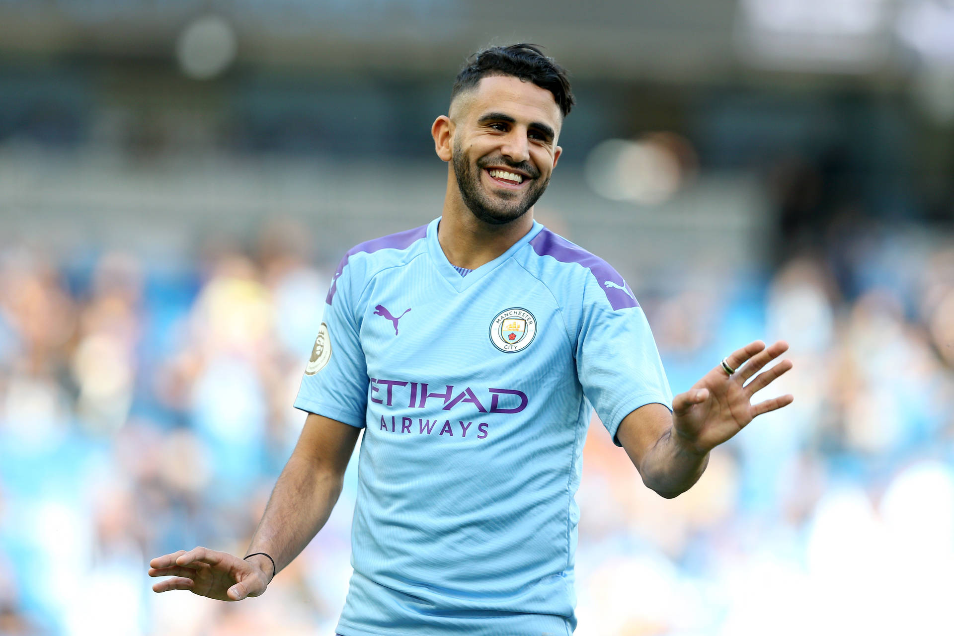 Riyad Mahrez Smiling Waving Background