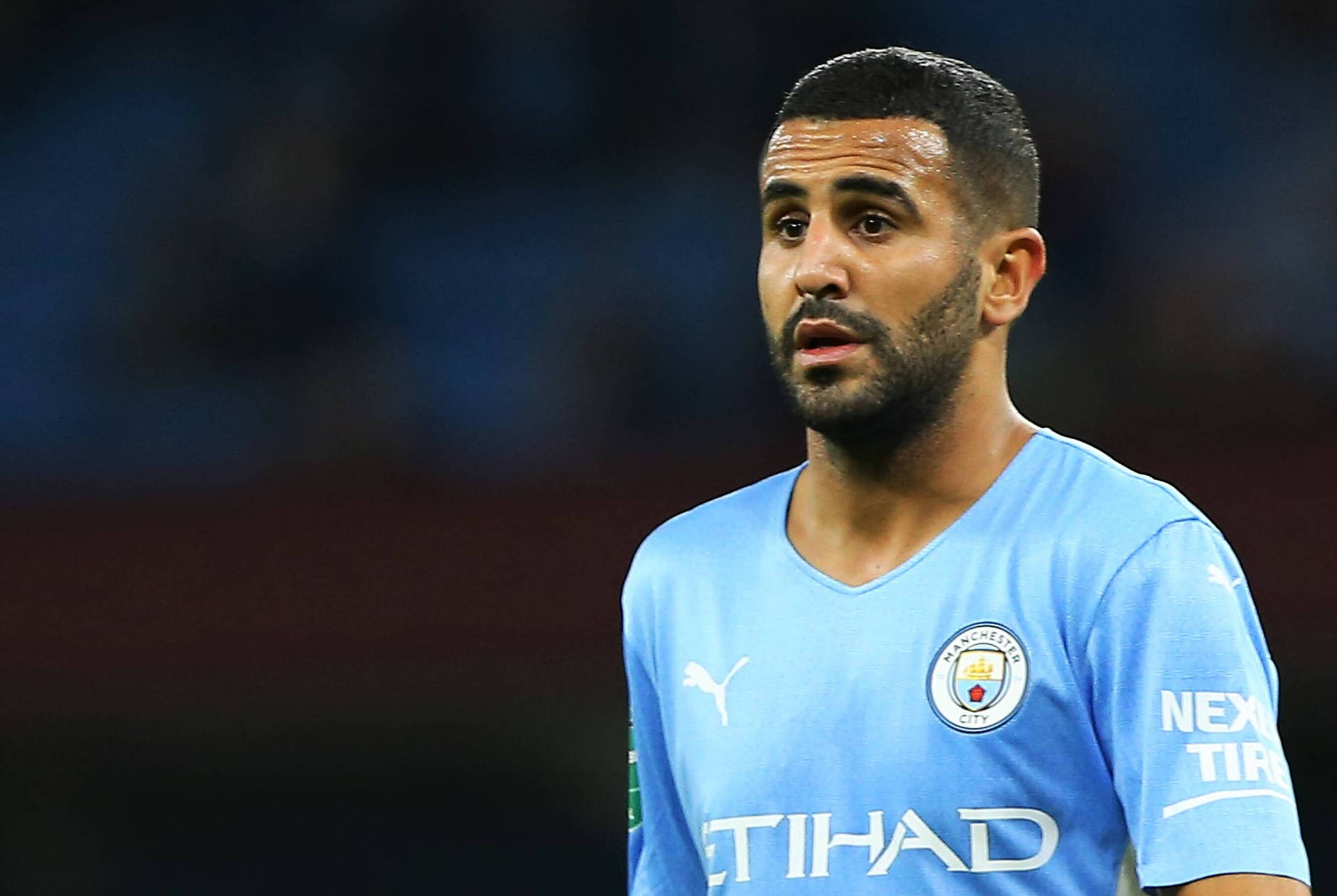 Riyad Mahrez Staring Ahead Background