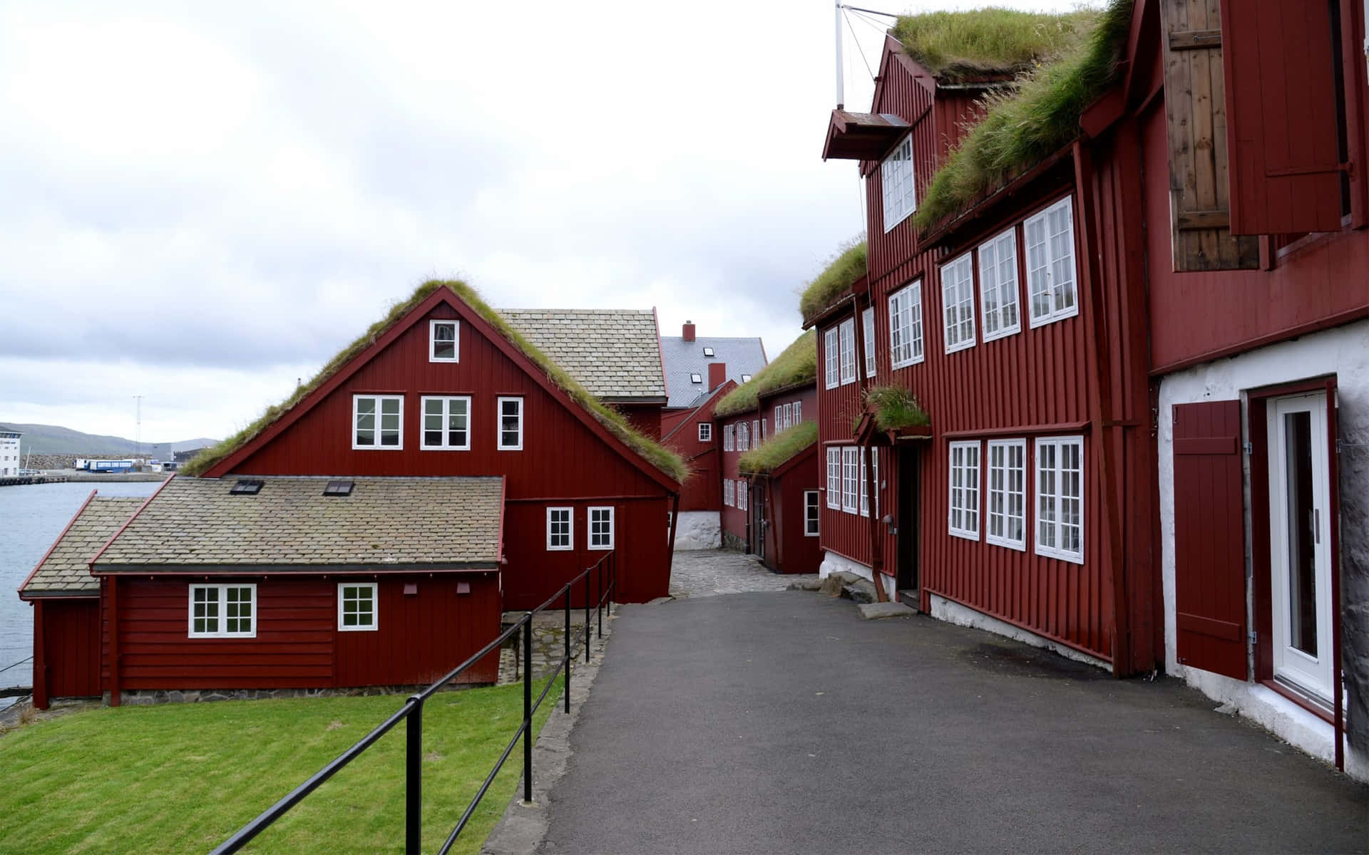 Road In Between Red Houses In Thorshavn Background