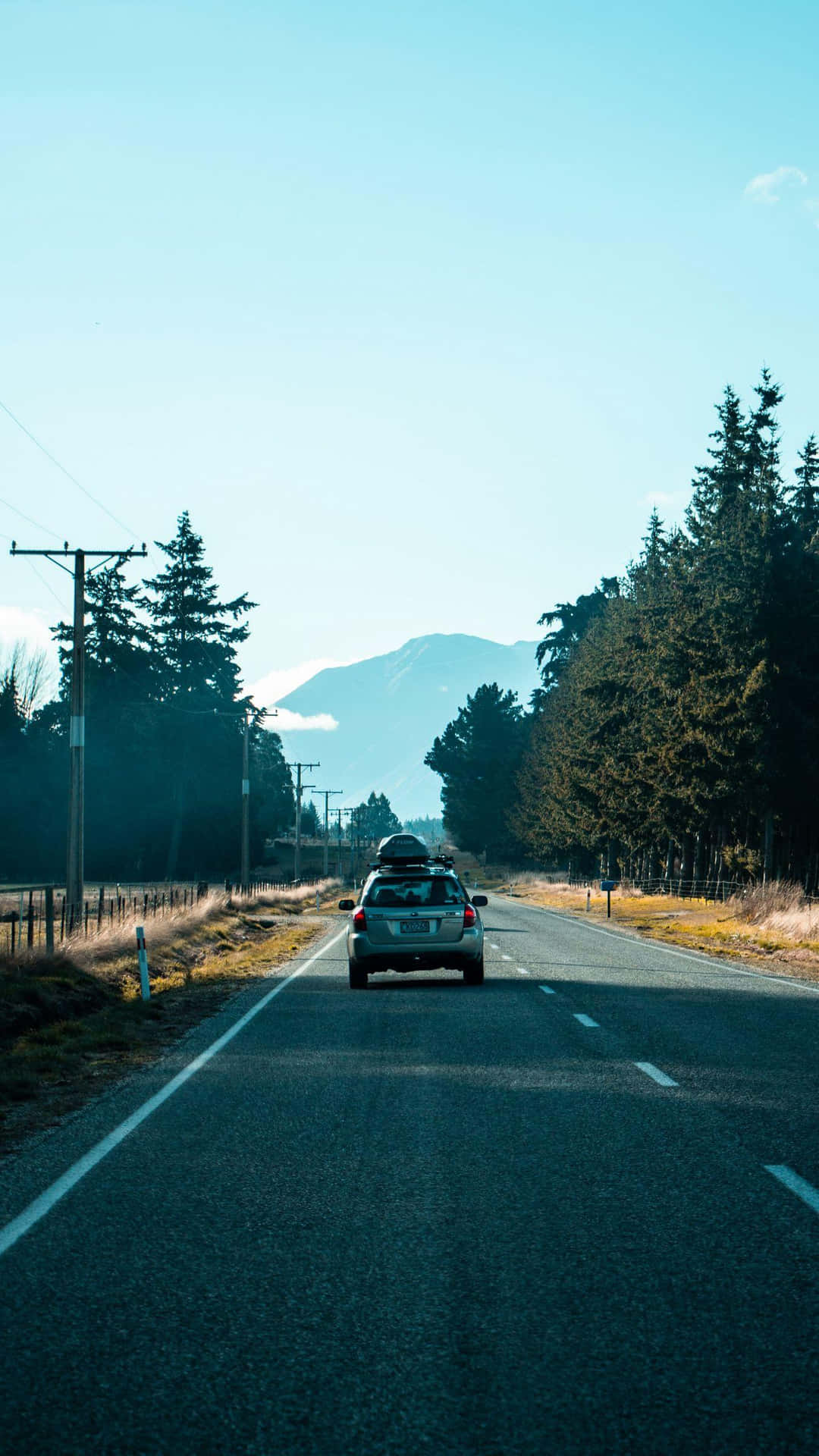 Road_ Trip_to_ Mountainous_ Terrain Background