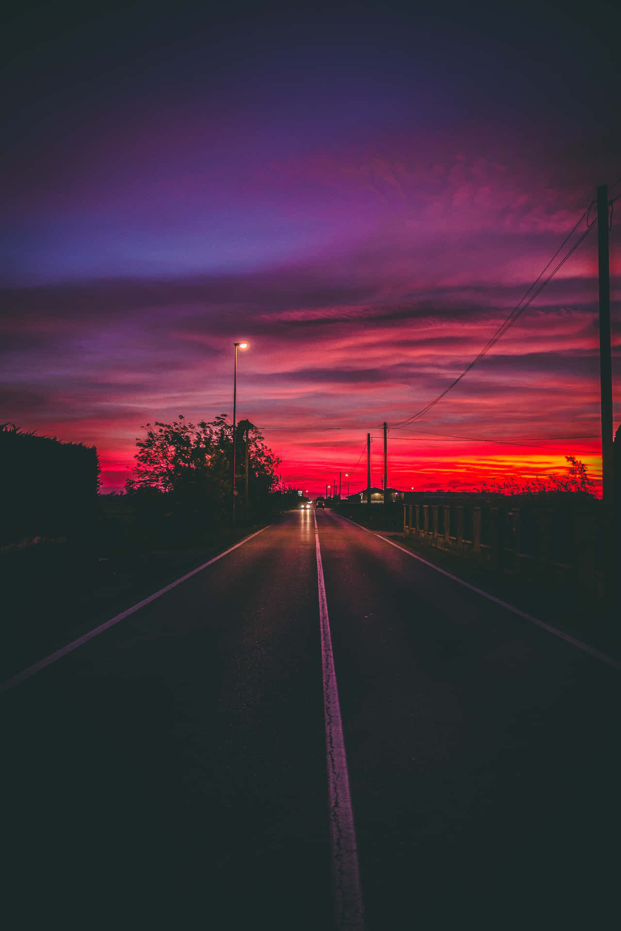 Road Under Red And Purple Evening Sky Background