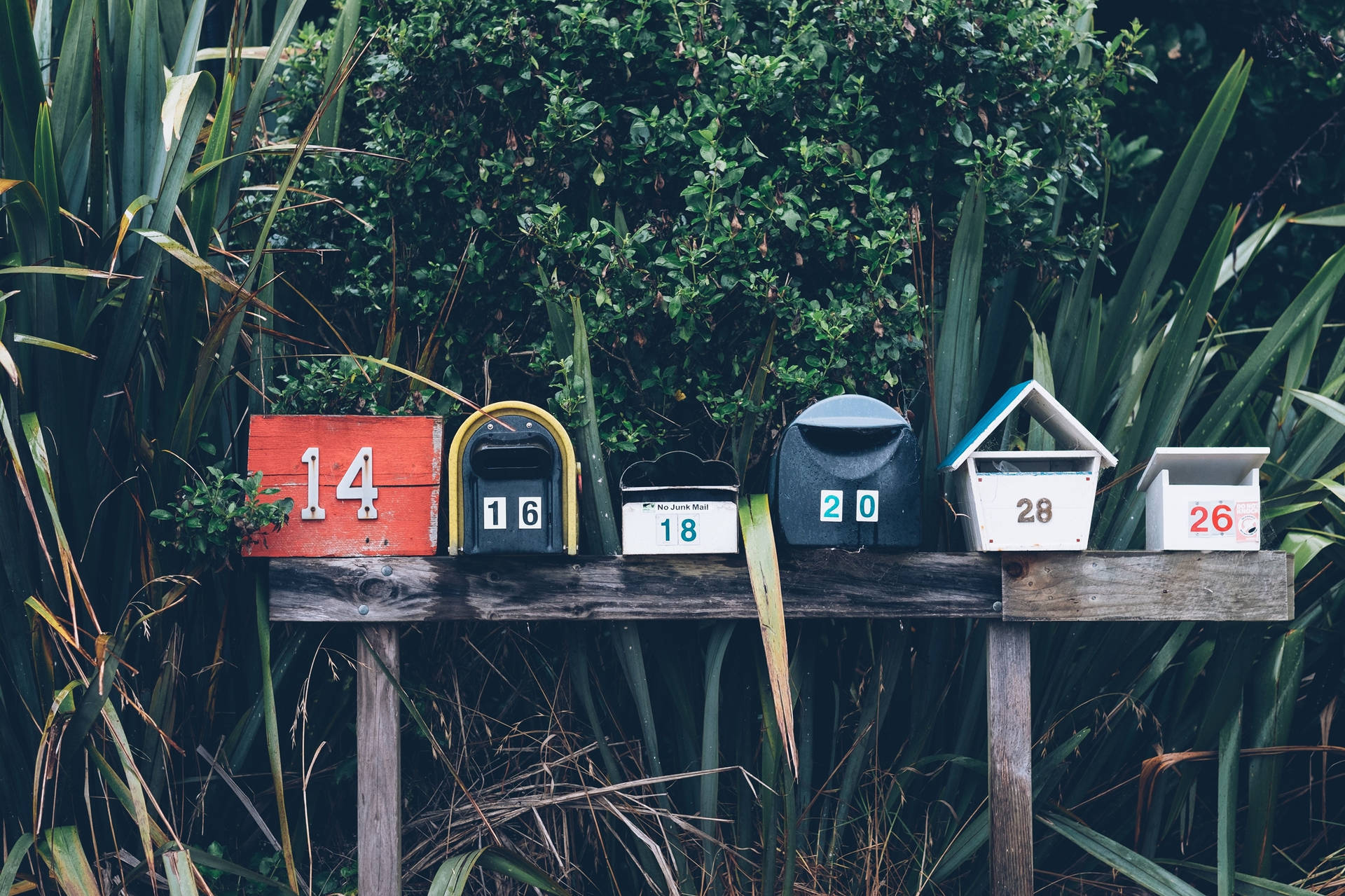 Roadside Makeshift Mailboxes In A Row Background