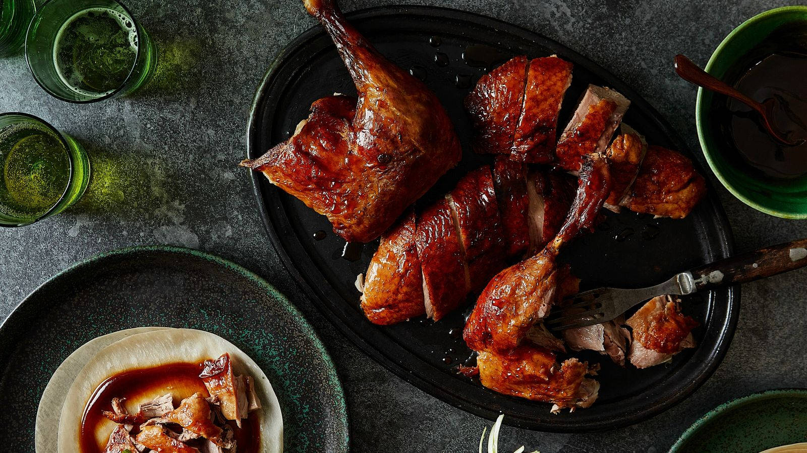 Roasted Peking Duck Pieces On Black Plate Background