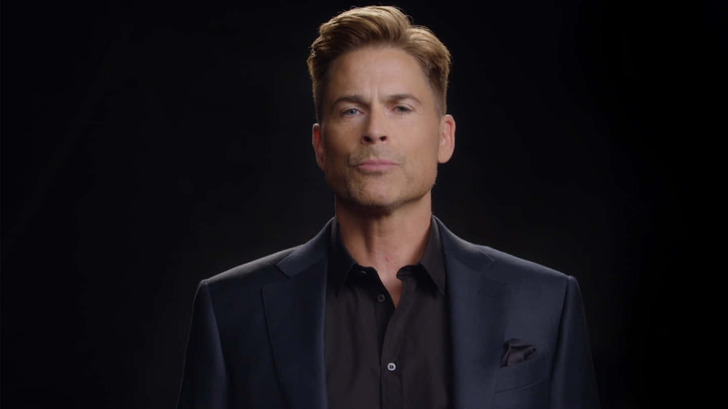 Rob Lowe Brings An Easy Smile And Confident Stance Background