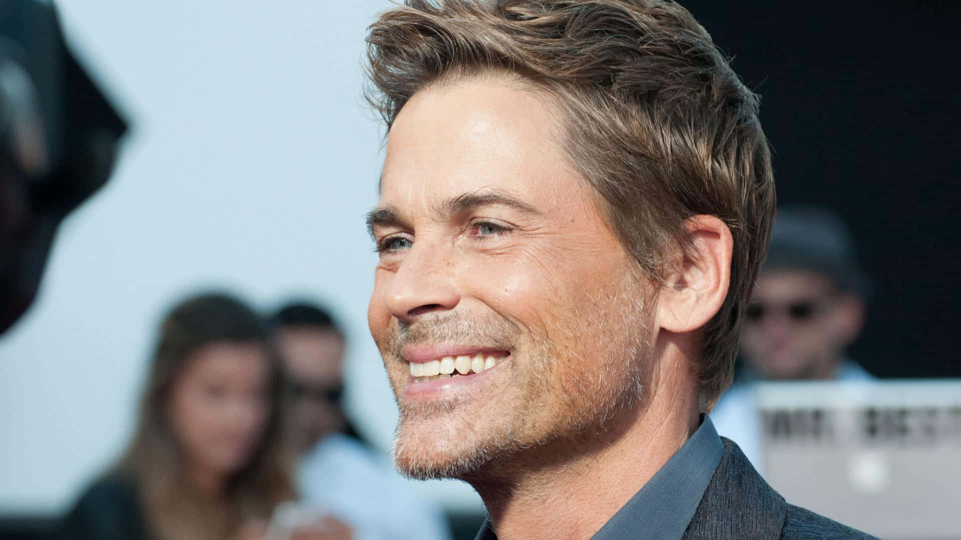 Rob Lowe Looking Dashing In A Crisp White Shirt Background