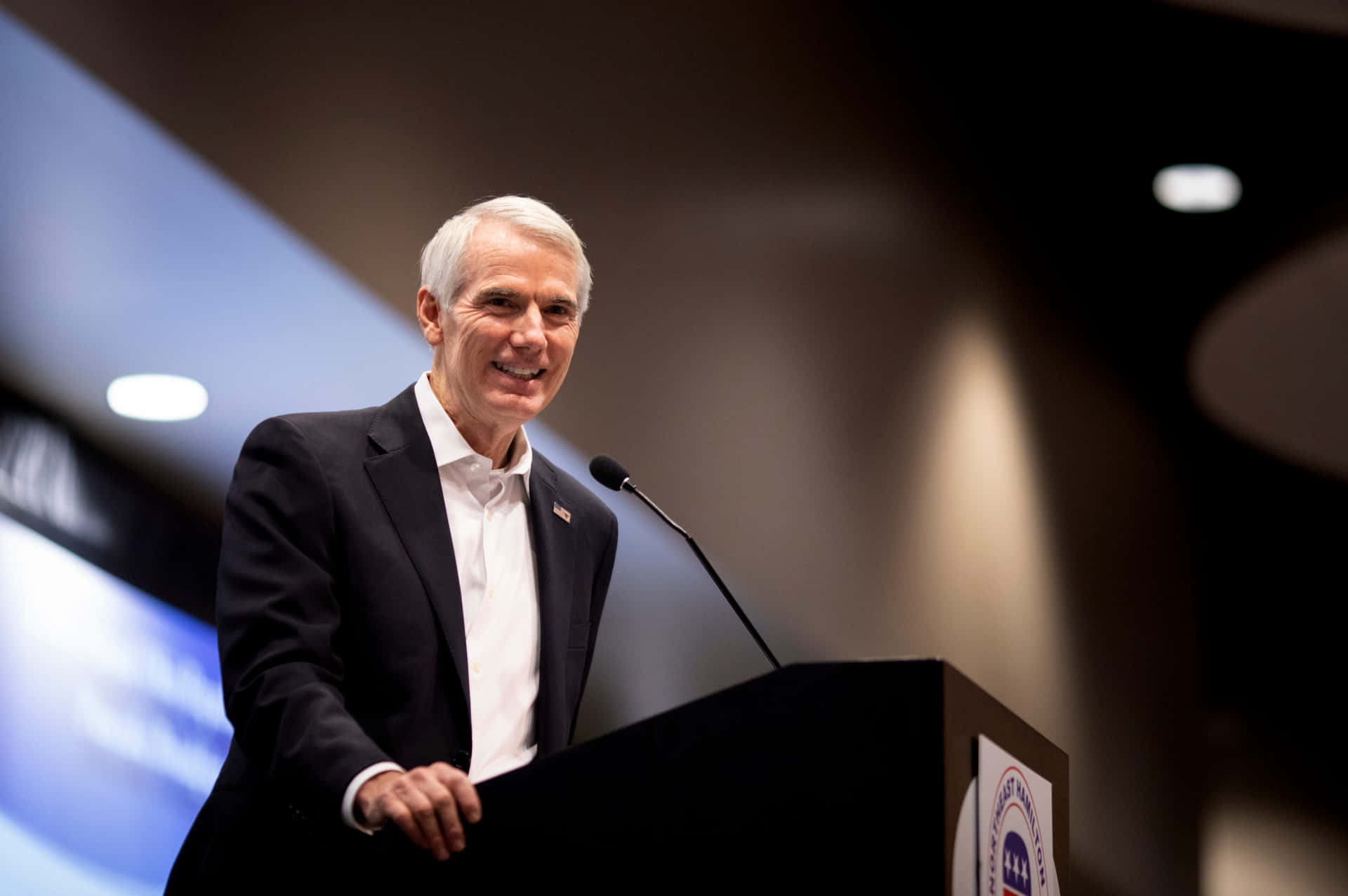 Rob Portman Delivers A Speech From Podium Background